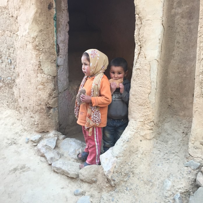 Berber children at their home, snacking